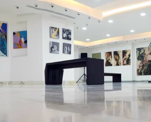 Showroom wide with opening exhibition paintings